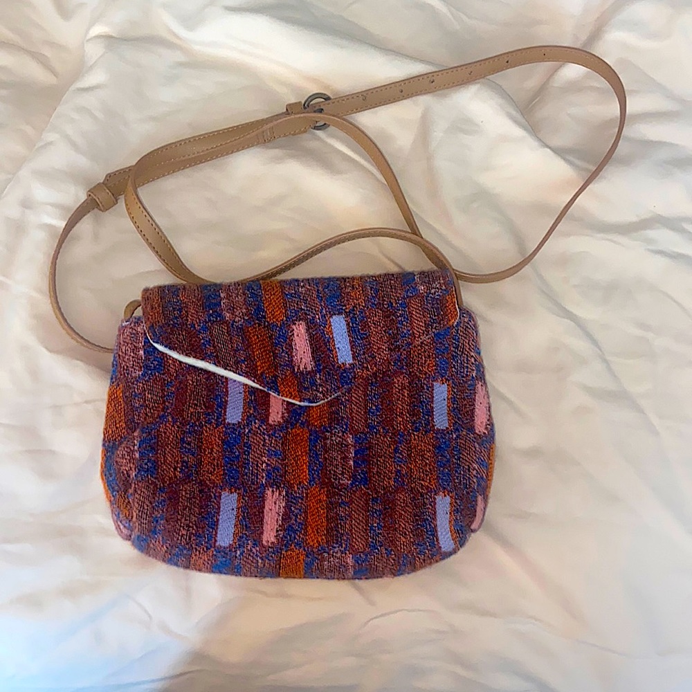 Small purse from Target. Gently used. Zipper pocket inside. Adjustable strap.